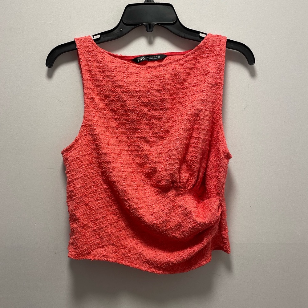 Bright pink sleeveless blouse